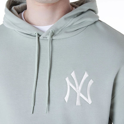 The Male model is wearing New York Yankees MLB League Essential Pastel Green Oversized Pullover Hoodie 4