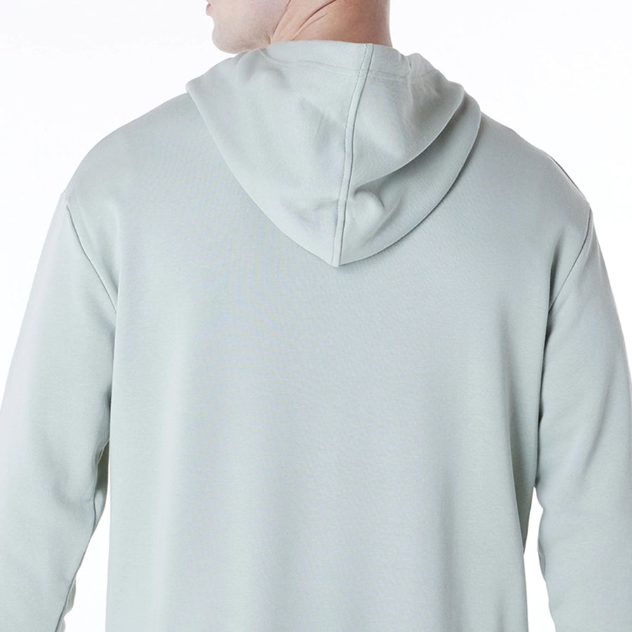 The Male model is wearing New York Yankees MLB League Essential Pastel Green Oversized Pullover Hoodie 7