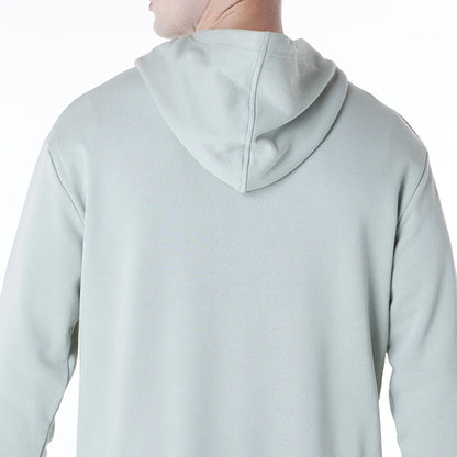 The Male model is wearing New York Yankees MLB League Essential Pastel Green Oversized Pullover Hoodie 7