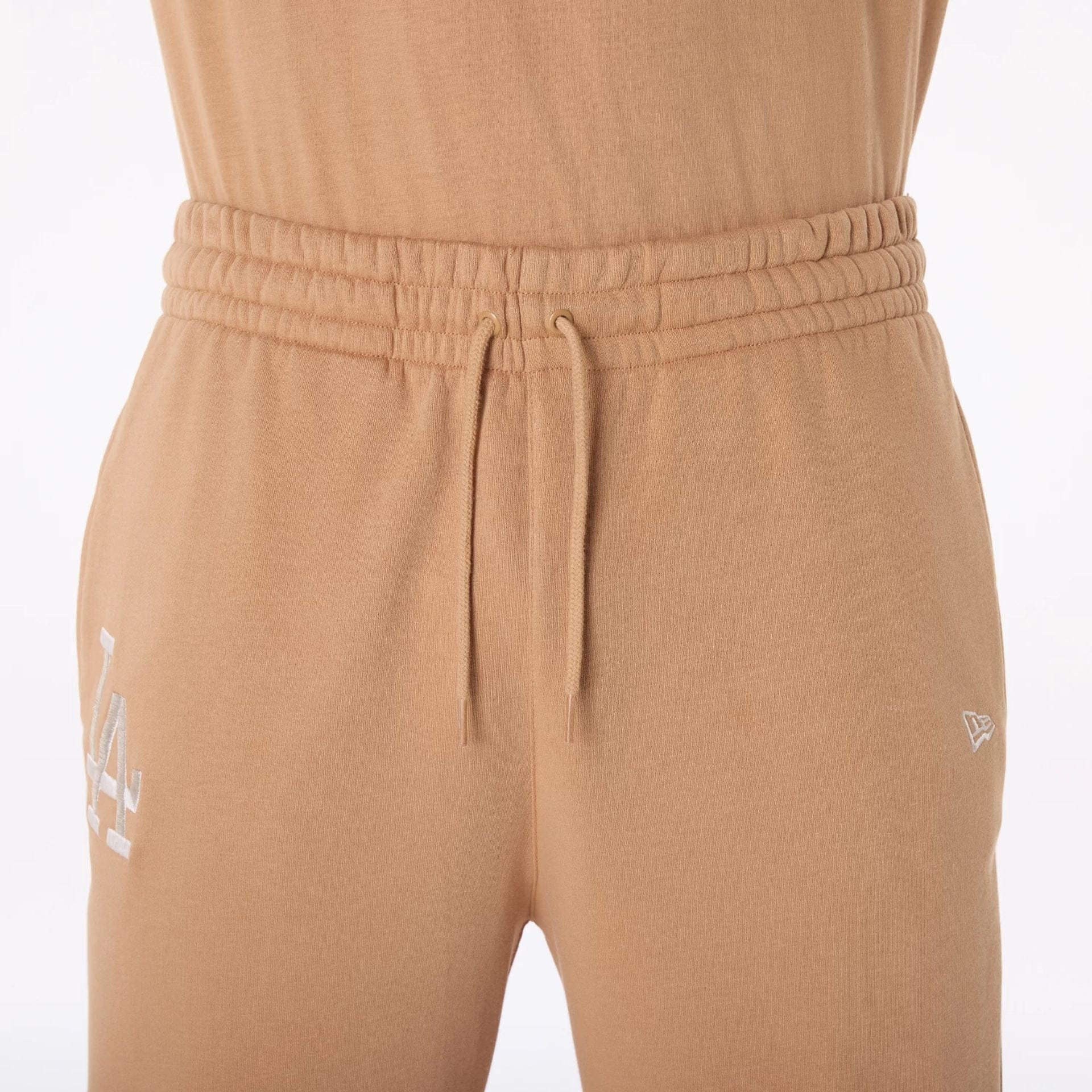 The Male model is wearing LA Dodgers MLB League Essential Dark Beige Fleece Joggers 6