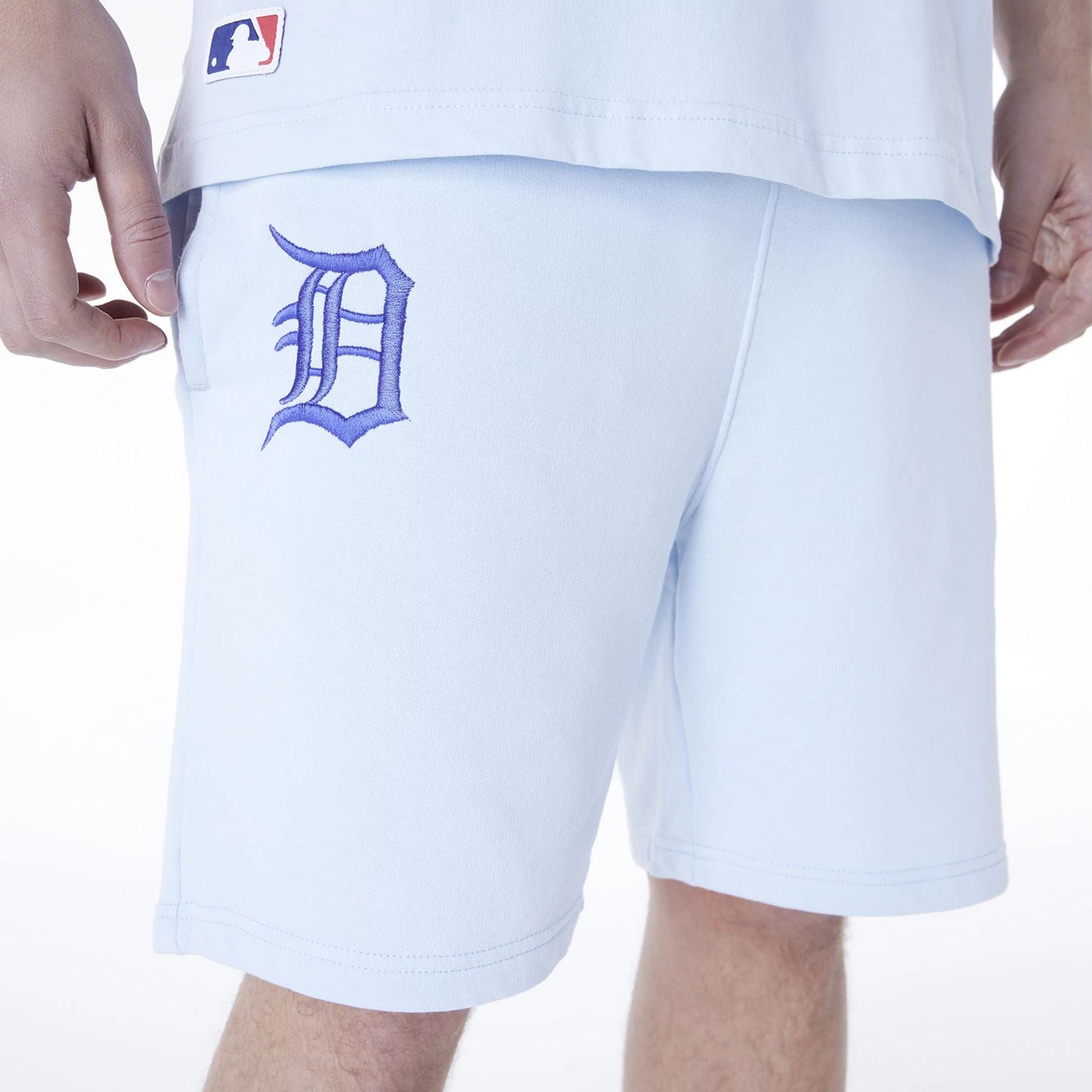 The Male model is wearing Detroit Tigers MLB League Essential Pastel Blue Shorts 3