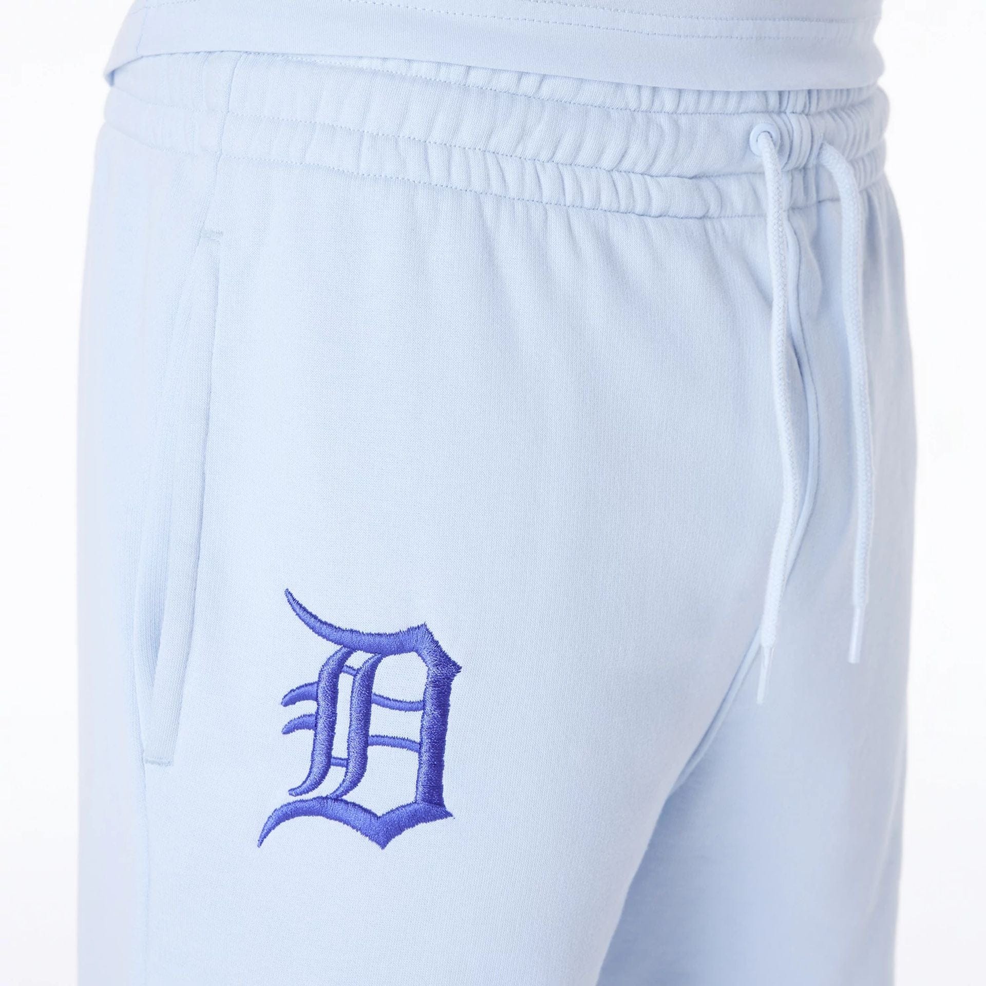 The Male model is wearing Detroit Tigers MLB League Essential Pastel Blue Shorts 6
