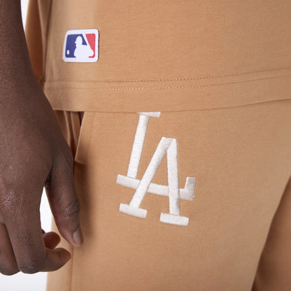 The Male model is wearing LA Dodgers MLB League Essential Dark Beige Shorts 4