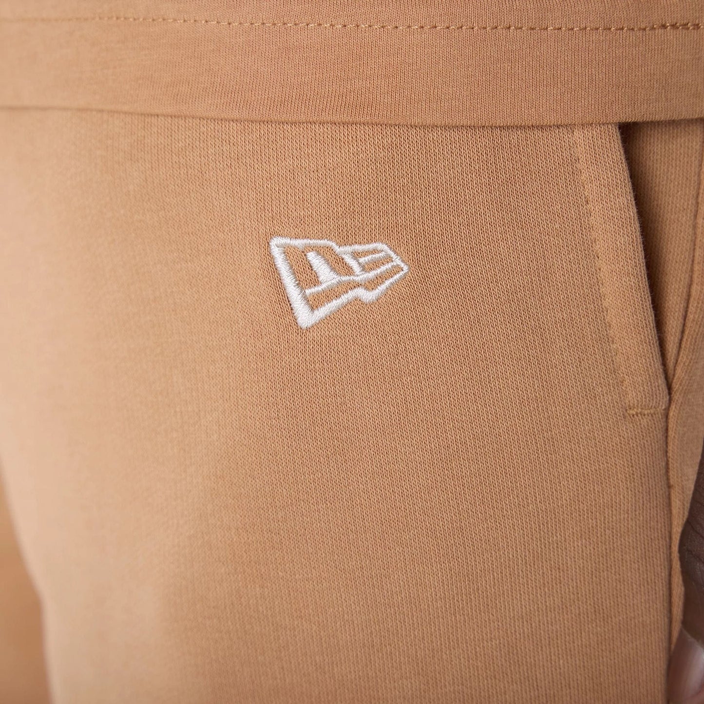 The Male model is wearing LA Dodgers MLB League Essential Dark Beige Shorts 5