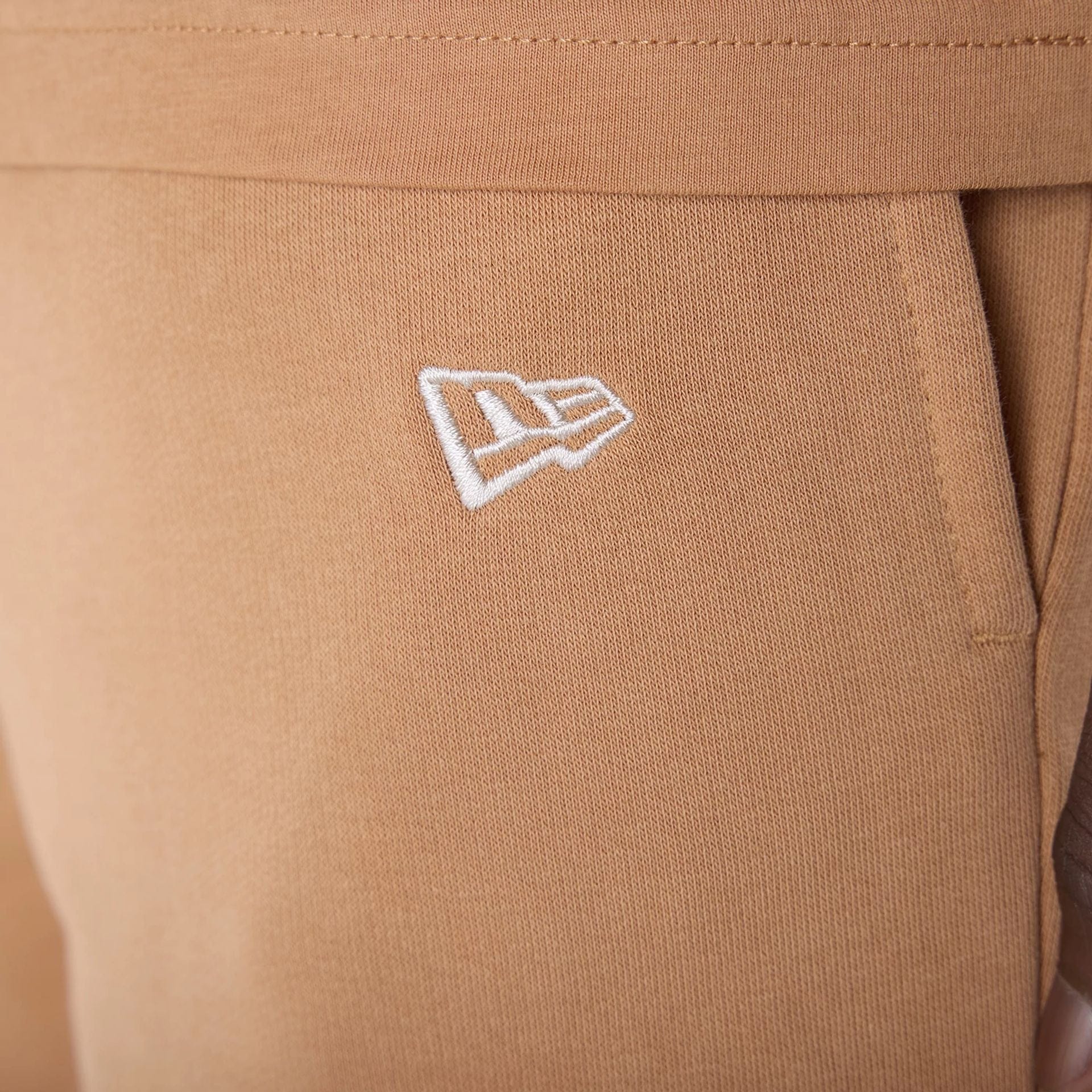 The Male model is wearing LA Dodgers MLB League Essential Dark Beige Shorts 5