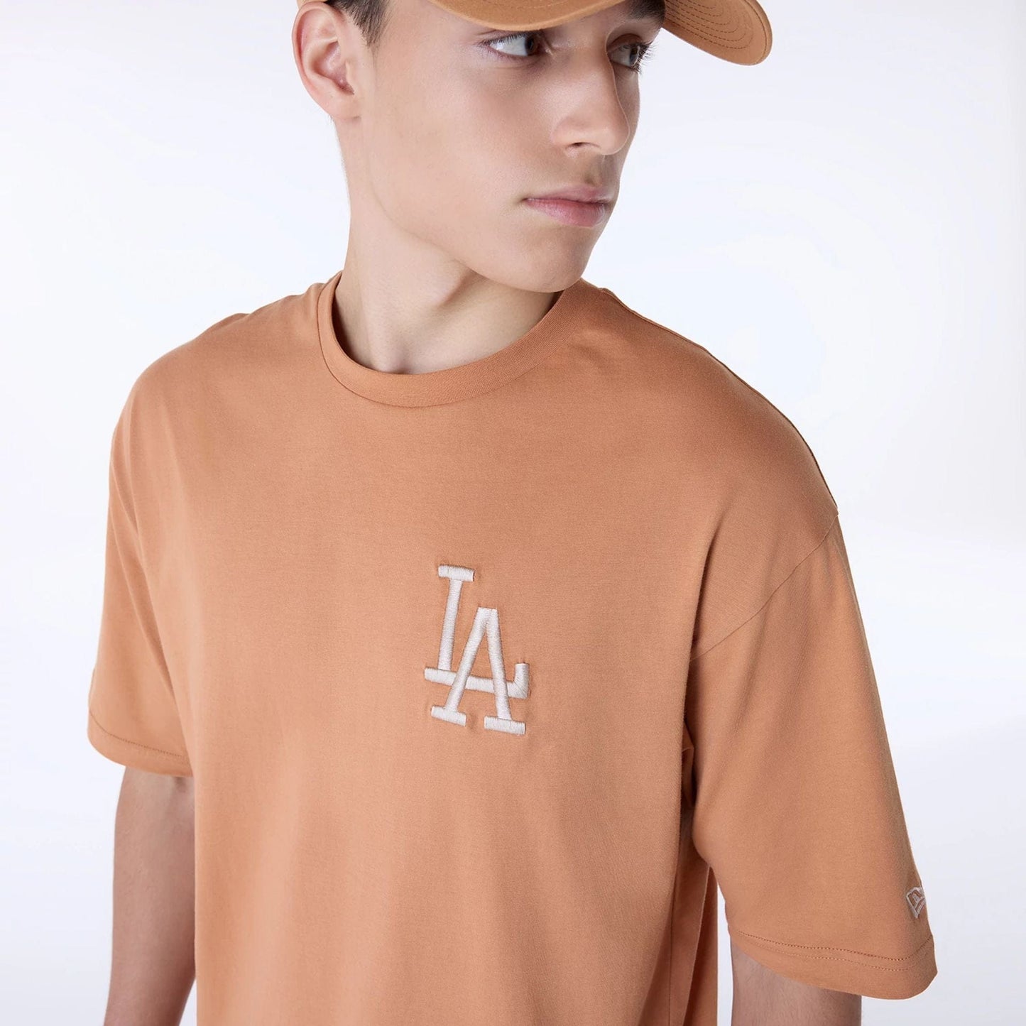 The Male model is wearing LA Dodgers MLB League Essential Dark Beige Oversized T-Shirt 4