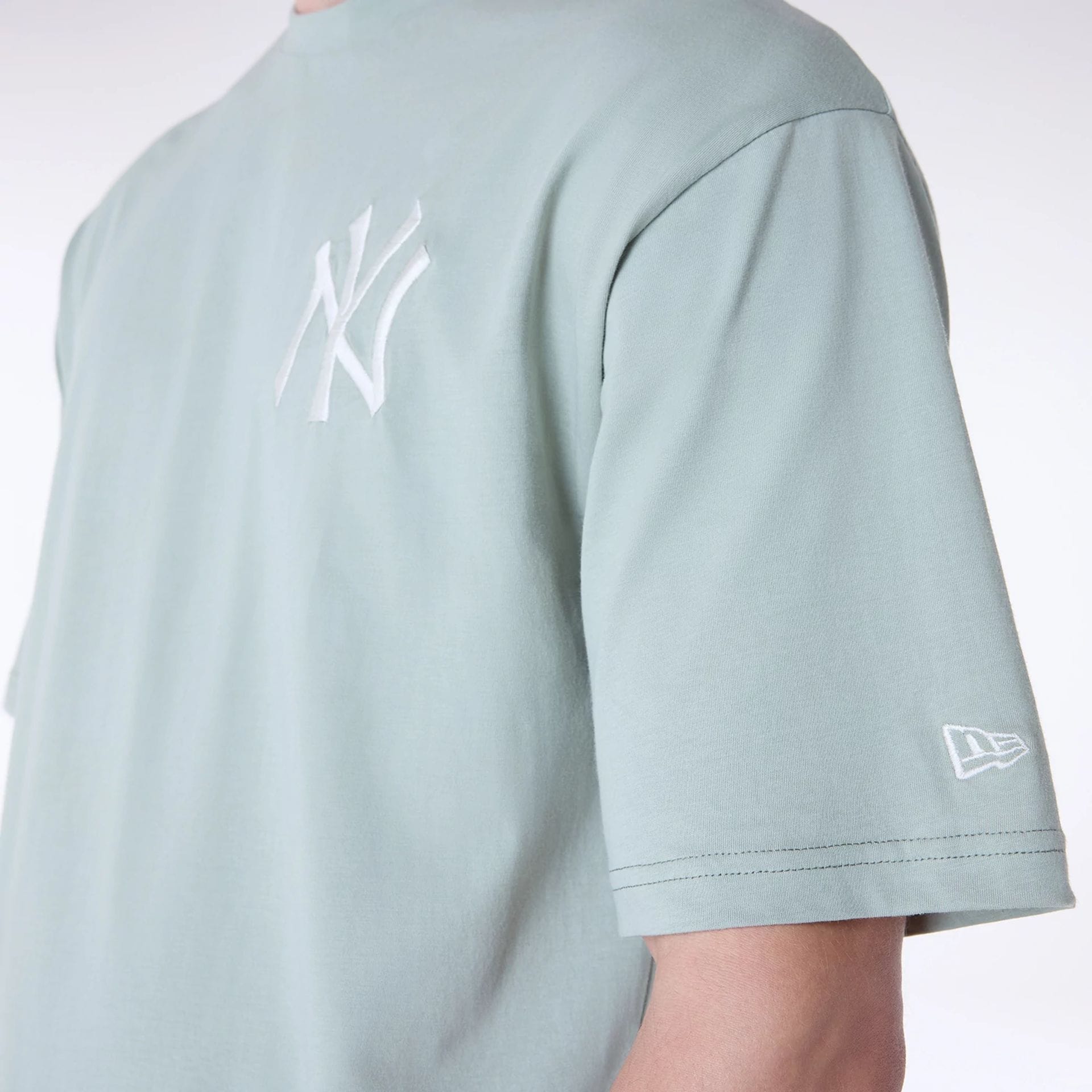 The Male model is wearing New York Yankees MLB League Essential Pastel Green Oversized T-Shirt 7