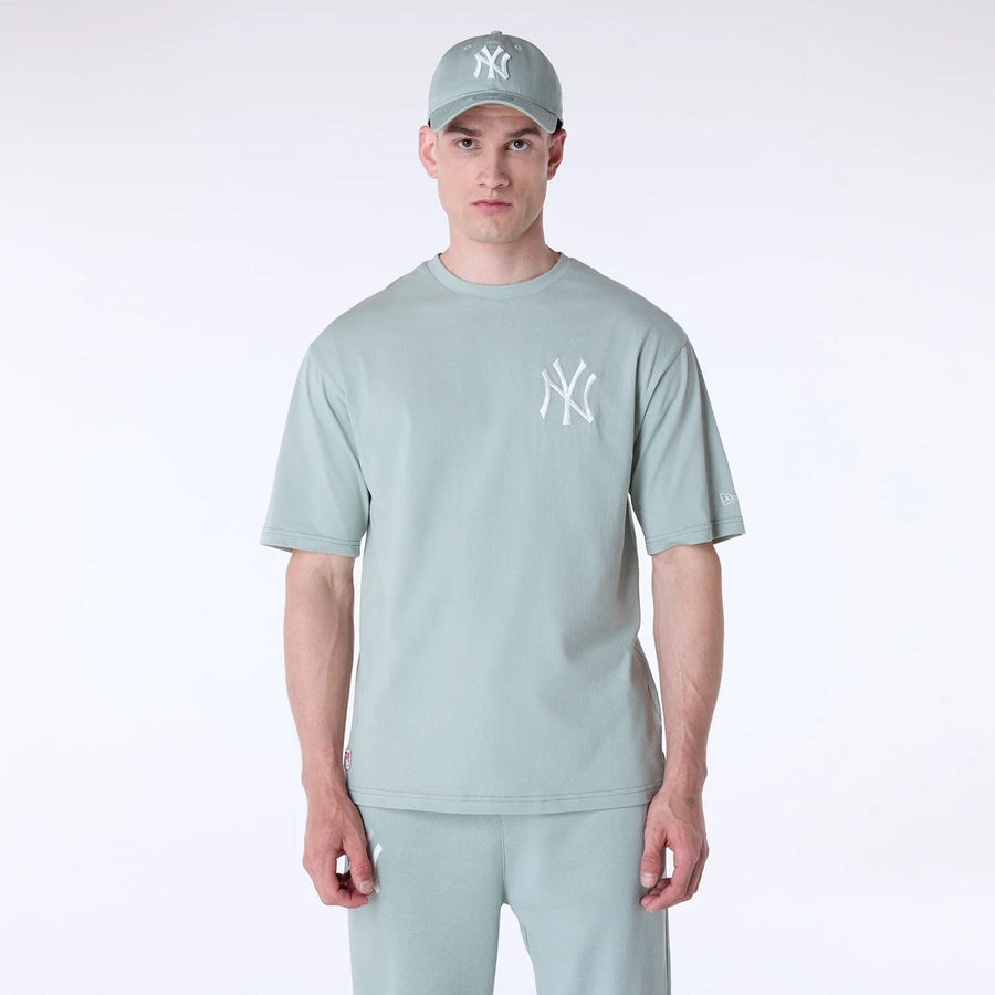 The Male model is wearing New York Yankees MLB League Essential Pastel Green Top And Shorts Set 3