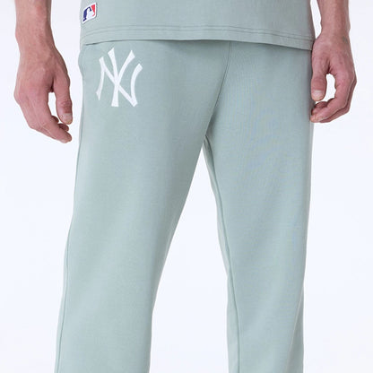 The Male model is wearing New York Yankees MLB League Essential Pastel Green Fleece Joggers 6