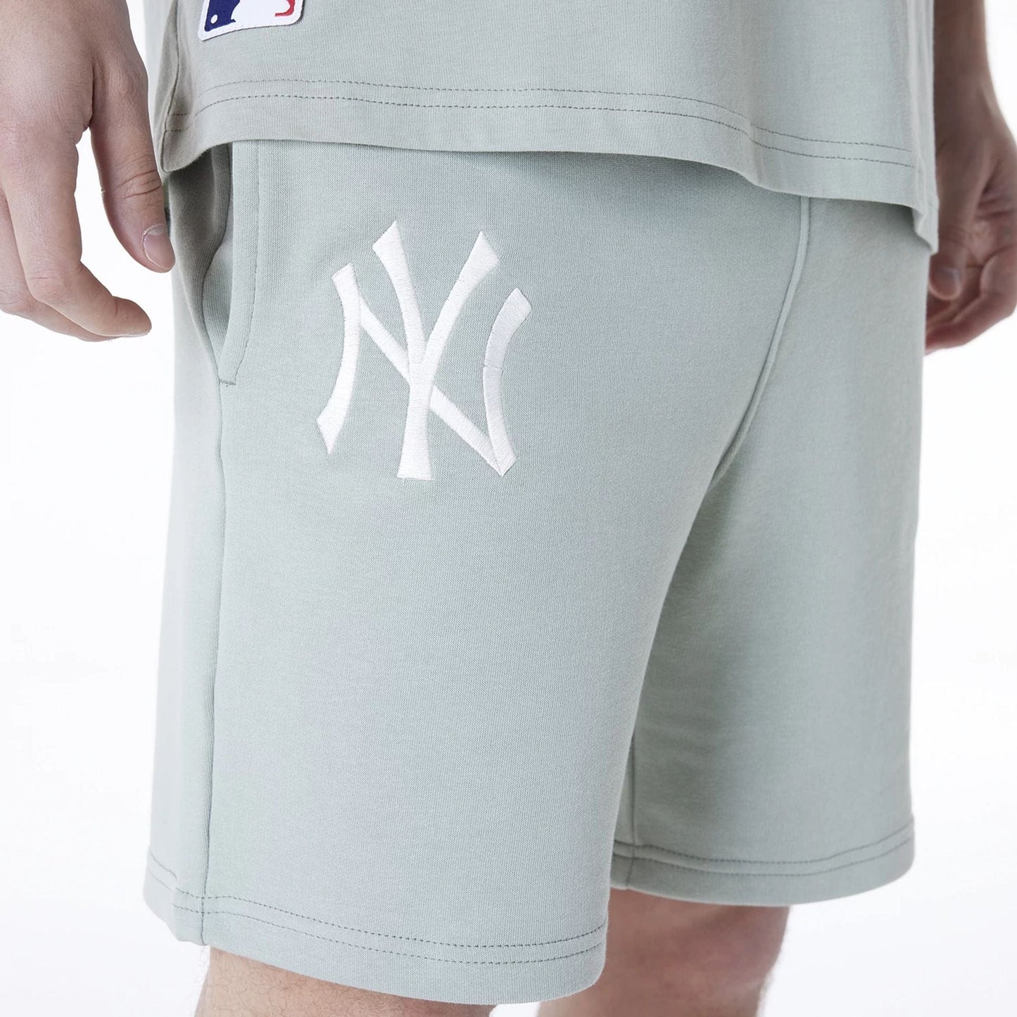 The Male model is wearing New York Yankees MLB League Essential Pastel Green Shorts 3