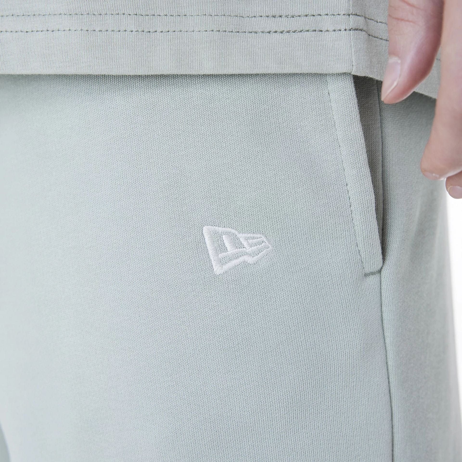 The Male model is wearing New York Yankees MLB League Essential Pastel Green Shorts 4