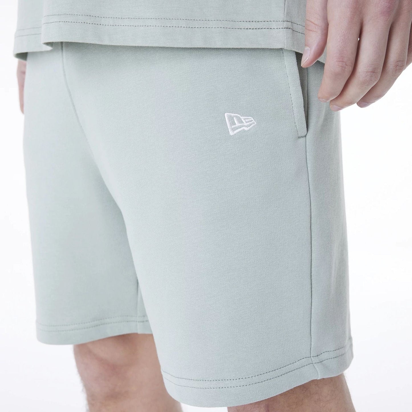 The Male model is wearing New York Yankees MLB League Essential Pastel Green Shorts 5