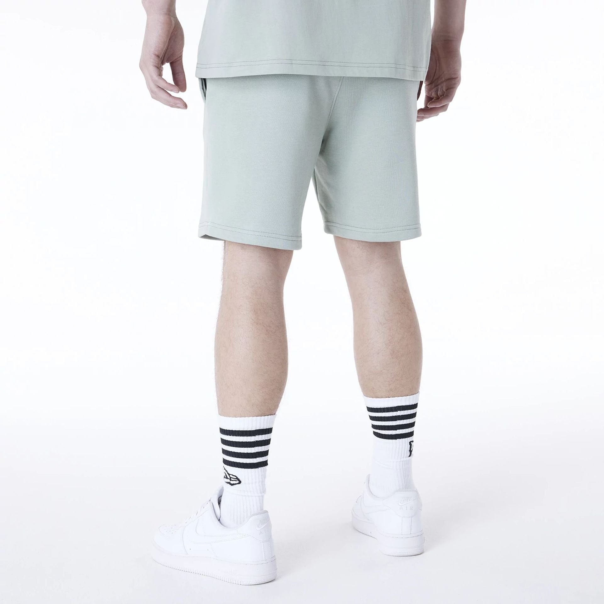 The Male model is wearing New York Yankees MLB League Essential Pastel Green Top And Shorts Set 5