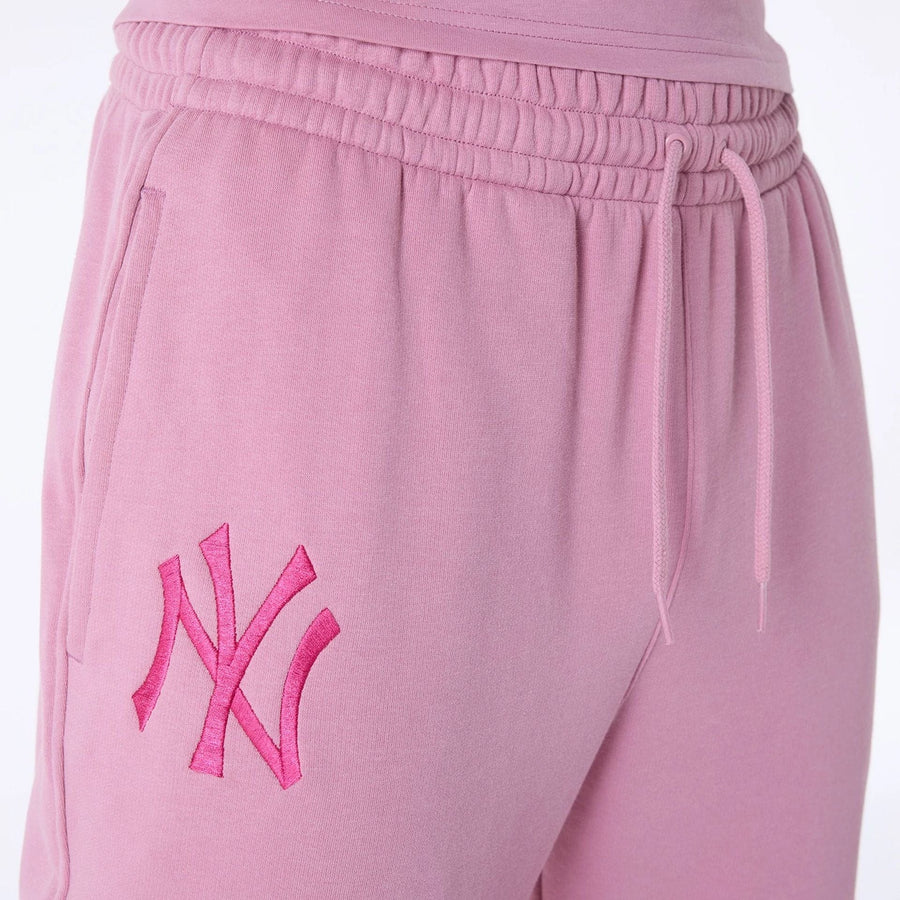 The Male model is wearing New York Yankees MLB League Essential Dark Pink Fleece Joggers 7