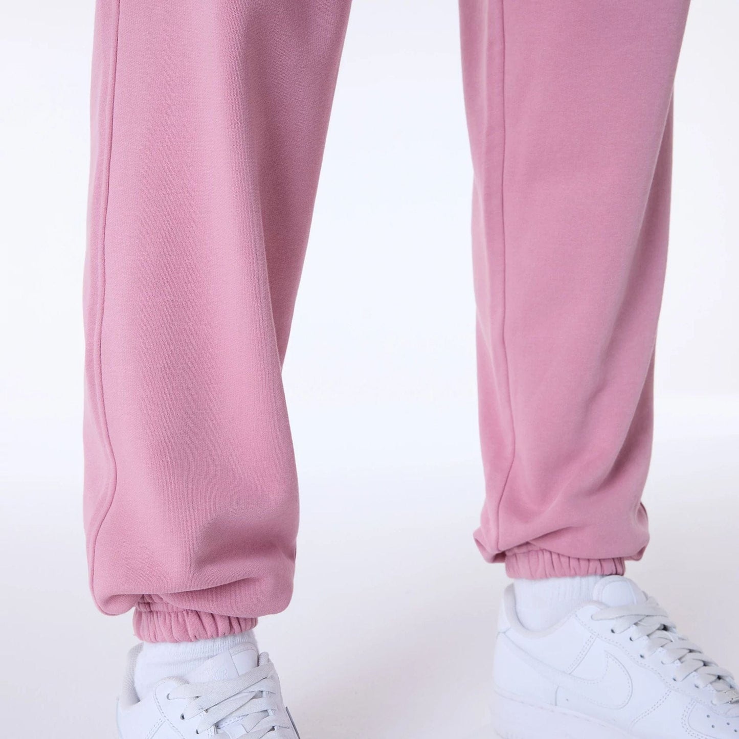The Male model is wearing New York Yankees MLB League Essential Dark Pink Fleece Joggers 3