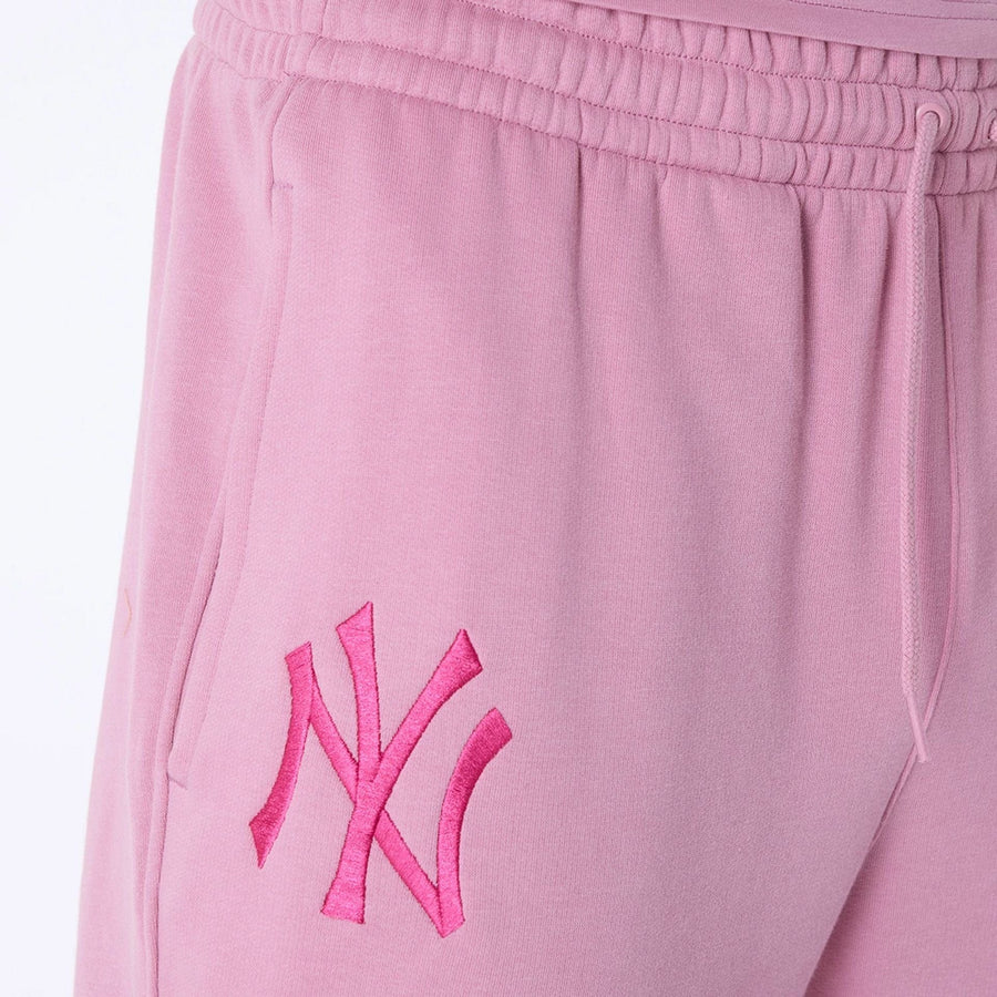 The Male model is wearing New York Yankees MLB League Essential Dark Pink Fleece Joggers 4