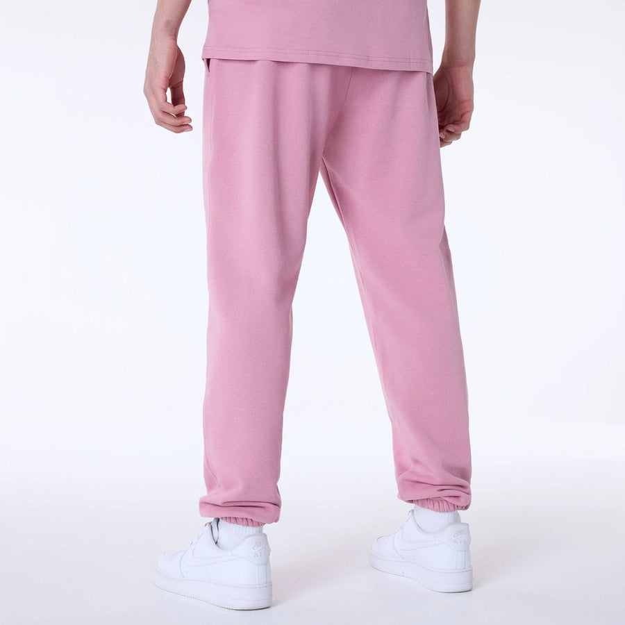 The Male model is wearing New York Yankees MLB League Essential Dark Pink Fleece Joggers 2