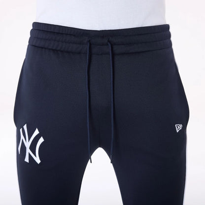 The Male model is wearing New York Yankees MLB Track Pants Navy Fleece Joggers 6