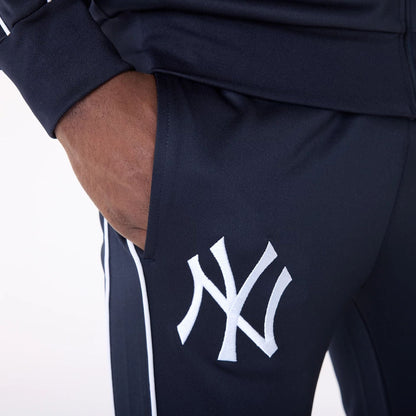 The Male model is wearing New York Yankees MLB Track Pants Navy Fleece Joggers 7