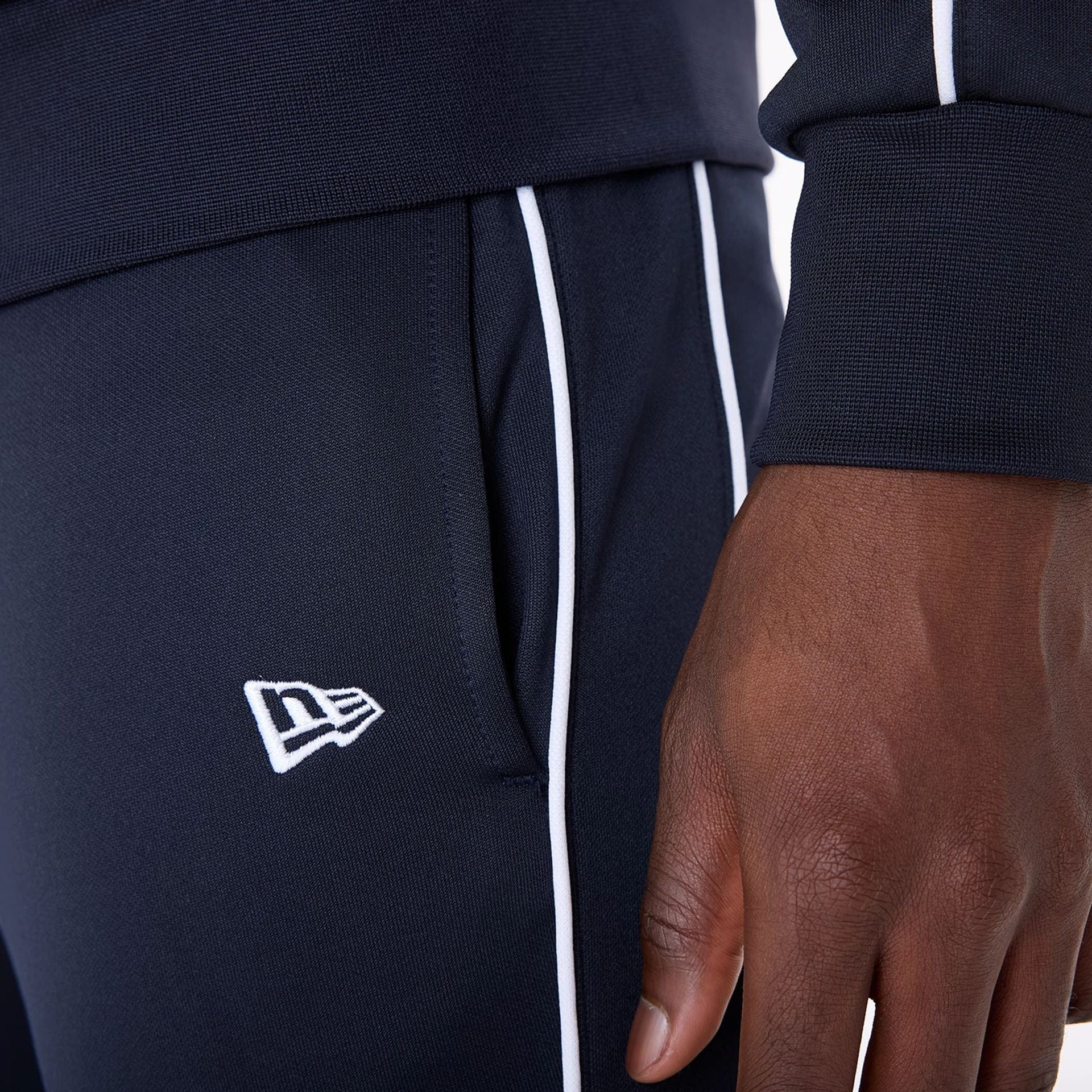 The Male model is wearing New York Yankees MLB Track Pants Navy Fleece Joggers 4