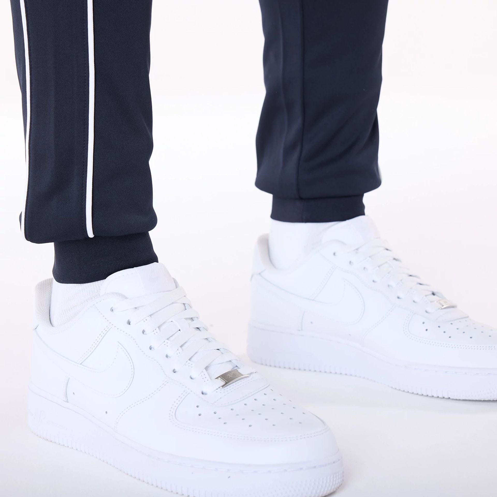 The Male model is wearing New York Yankees MLB Track Pants Navy Fleece Joggers 3