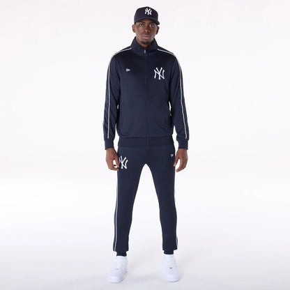 The Male model is wearing New York Yankees MLB Track Pants Navy Fleece Joggers 8