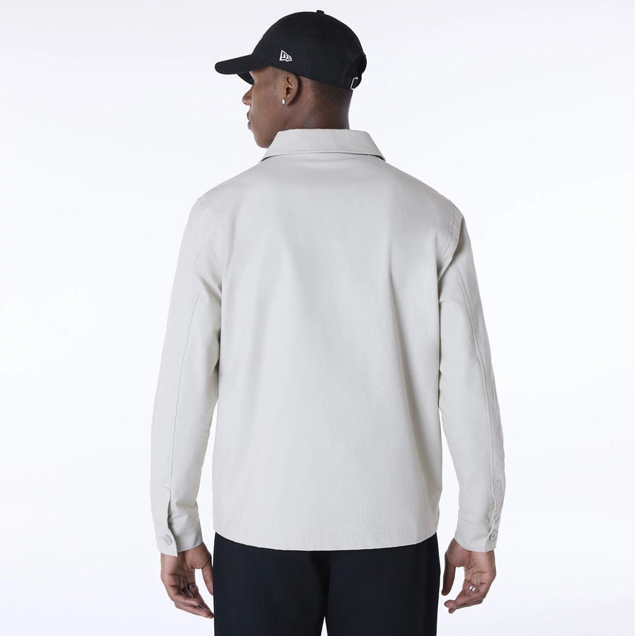The Male model is wearing New Era Essential Cream Shacket 2