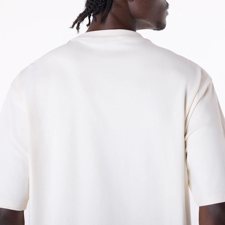The Male model is wearing New Era Graphic Open White Oversized T-Shirt 6