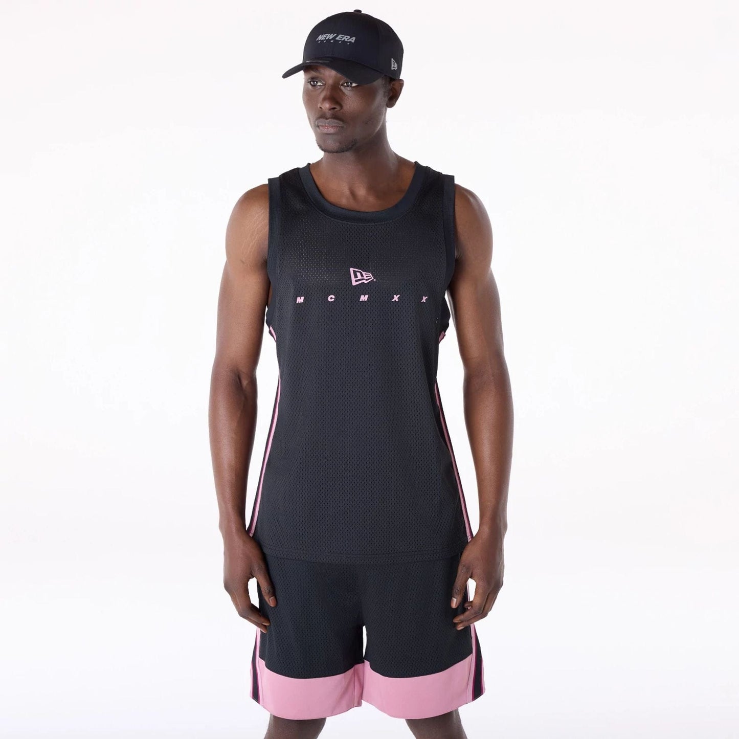 The Male model is wearing New Era Mesh Black Vest 1