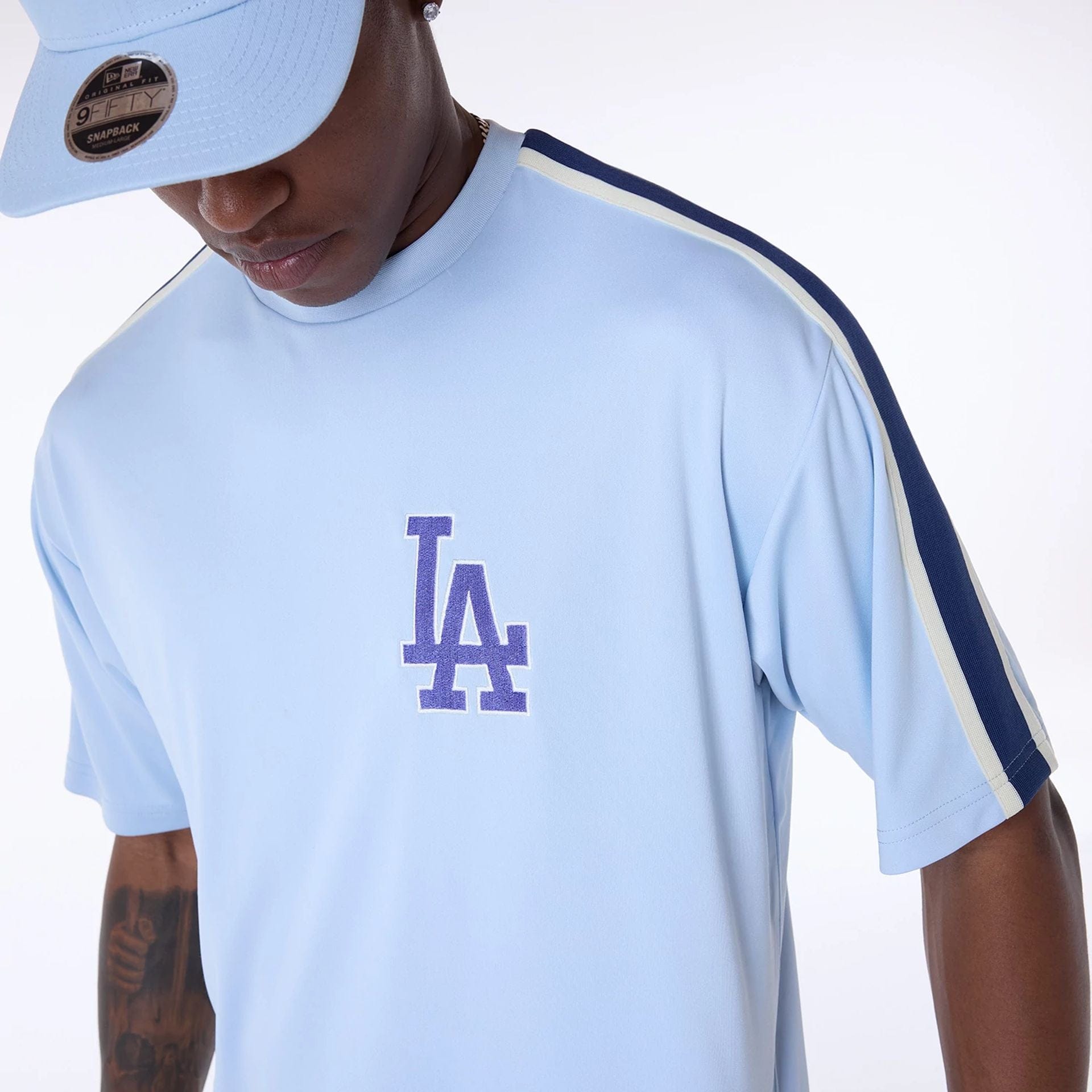 The Male model is wearing LA Dodgers MLB Floral Pastel Blue Oversized T-Shirt 7