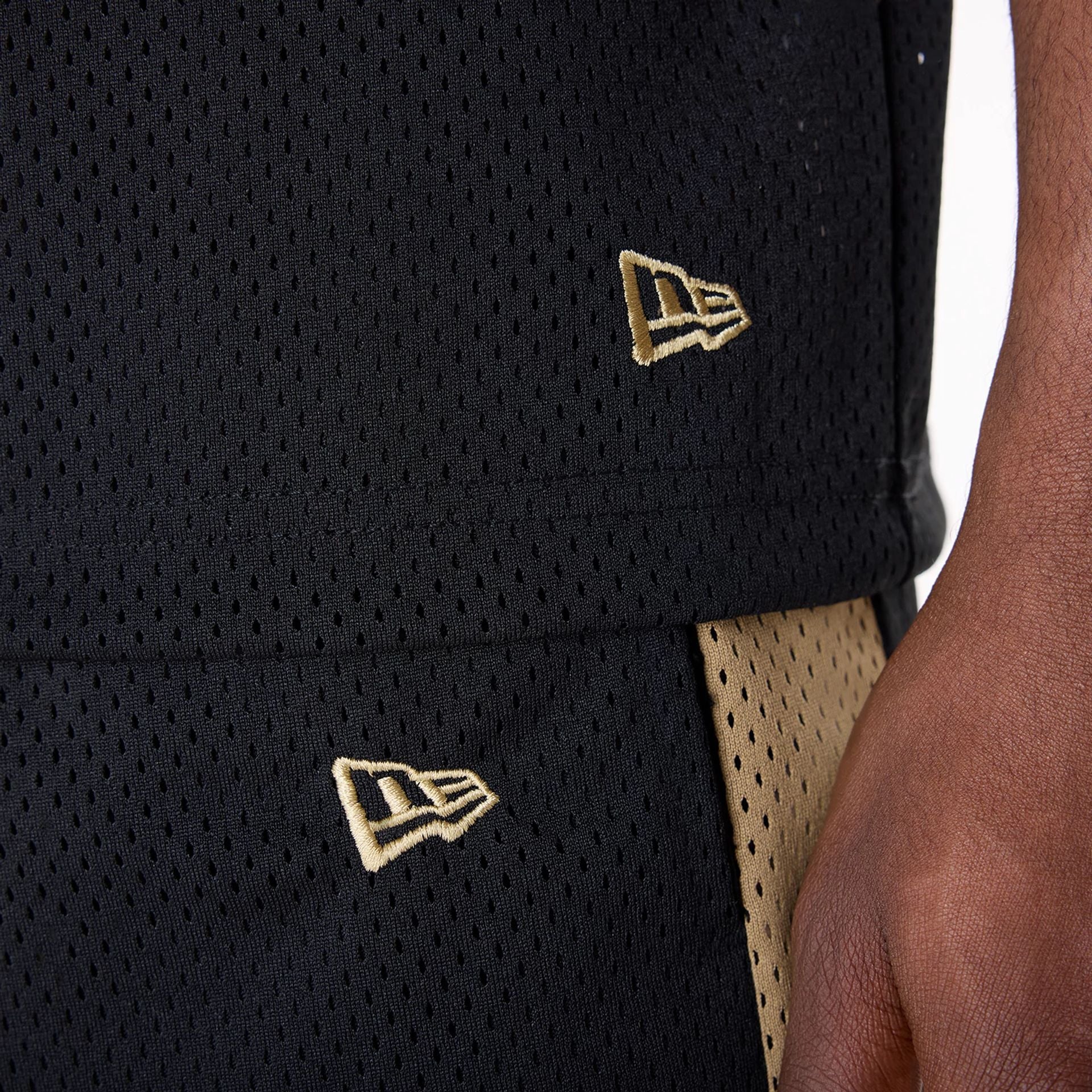 The Male model is wearing San Francisco 49ers NFL Mesh Black Shorts 5