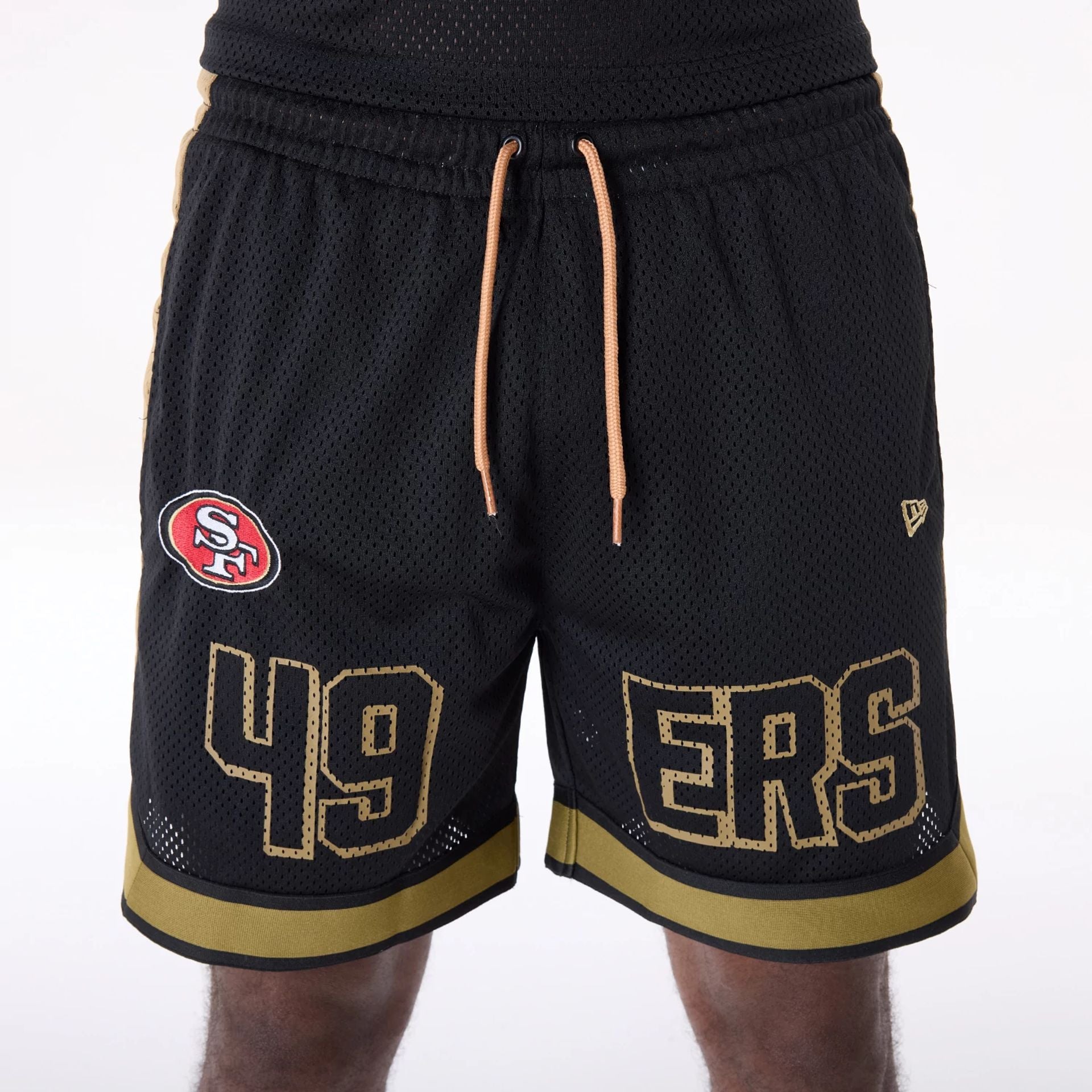 The Male model is wearing San Francisco 49ers NFL Mesh Black Shorts 4