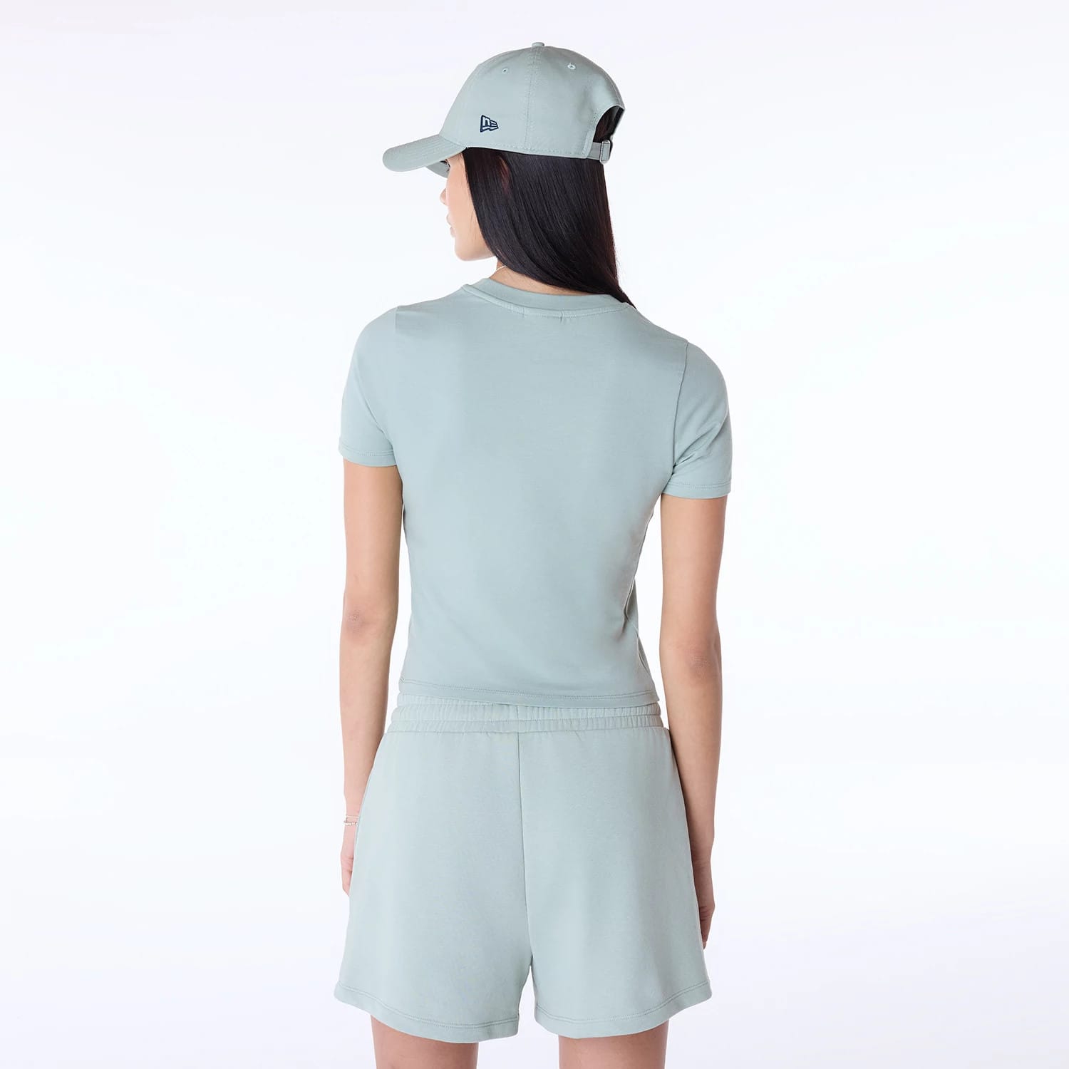 The Female model is wearing Womens New Era Slim Pastel Blue T-Shirt 7