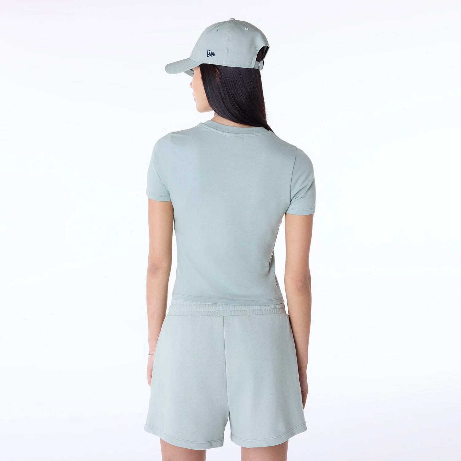 The Female model is wearing Womens New Era Slim Pastel Blue T-Shirt 7