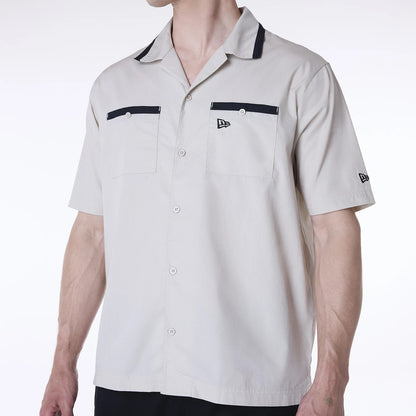 The Male model is wearing New Era Revere Cream Short Sleeve Shirt 2