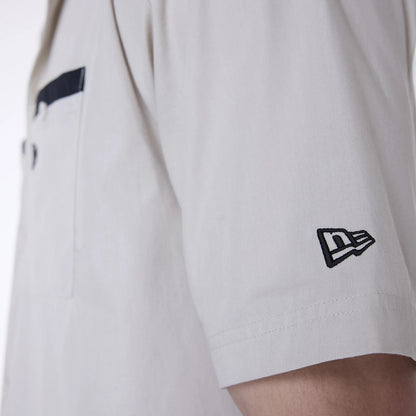 The Male model is wearing New Era Revere Cream Short Sleeve Shirt 7