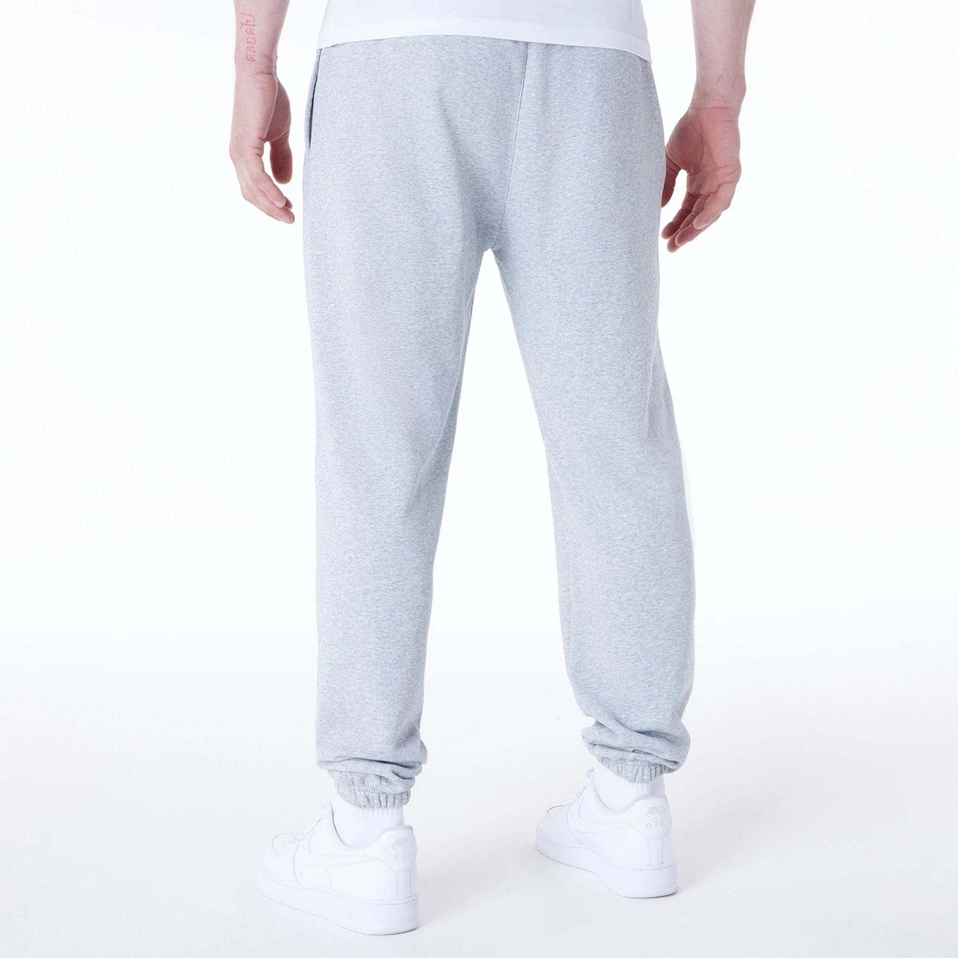 The Male model is wearing Brooklyn Nets NBA League Essential Grey Fleece Joggers 7