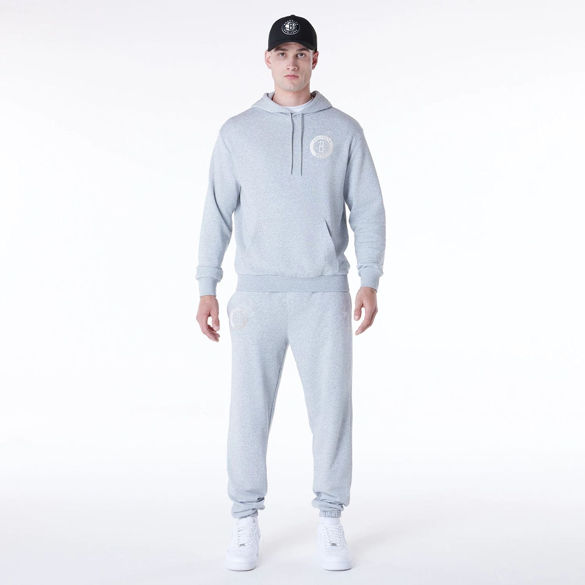 The Male model is wearing Brooklyn Nets NBA League Essential Grey Fleece Joggers 8
