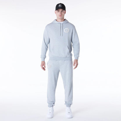 The Male model is wearing Brooklyn Nets NBA League Essential Grey Fleece Joggers 8
