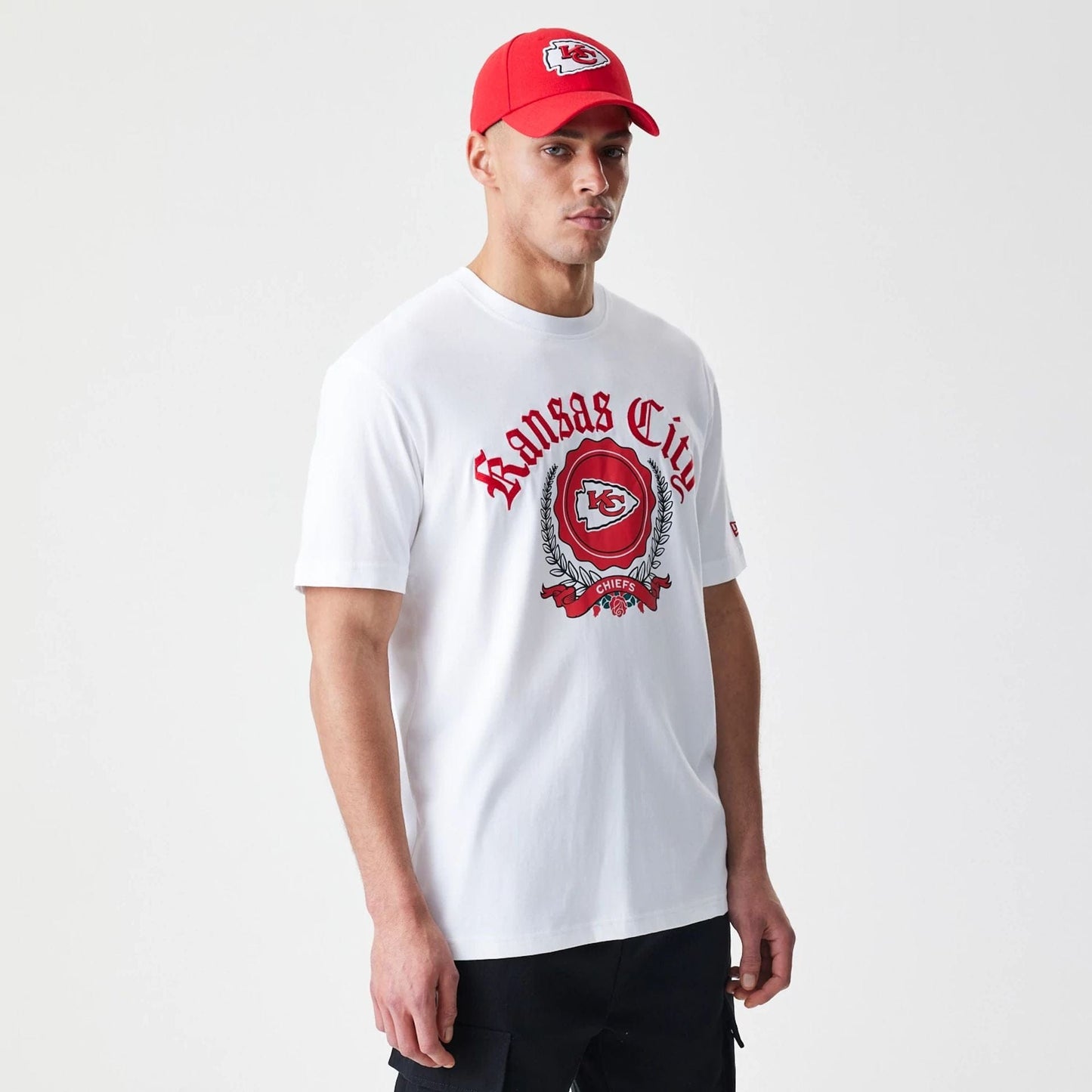 The Male model is wearing Kansas City Chiefs Throwback Prep White T-Shirt 1