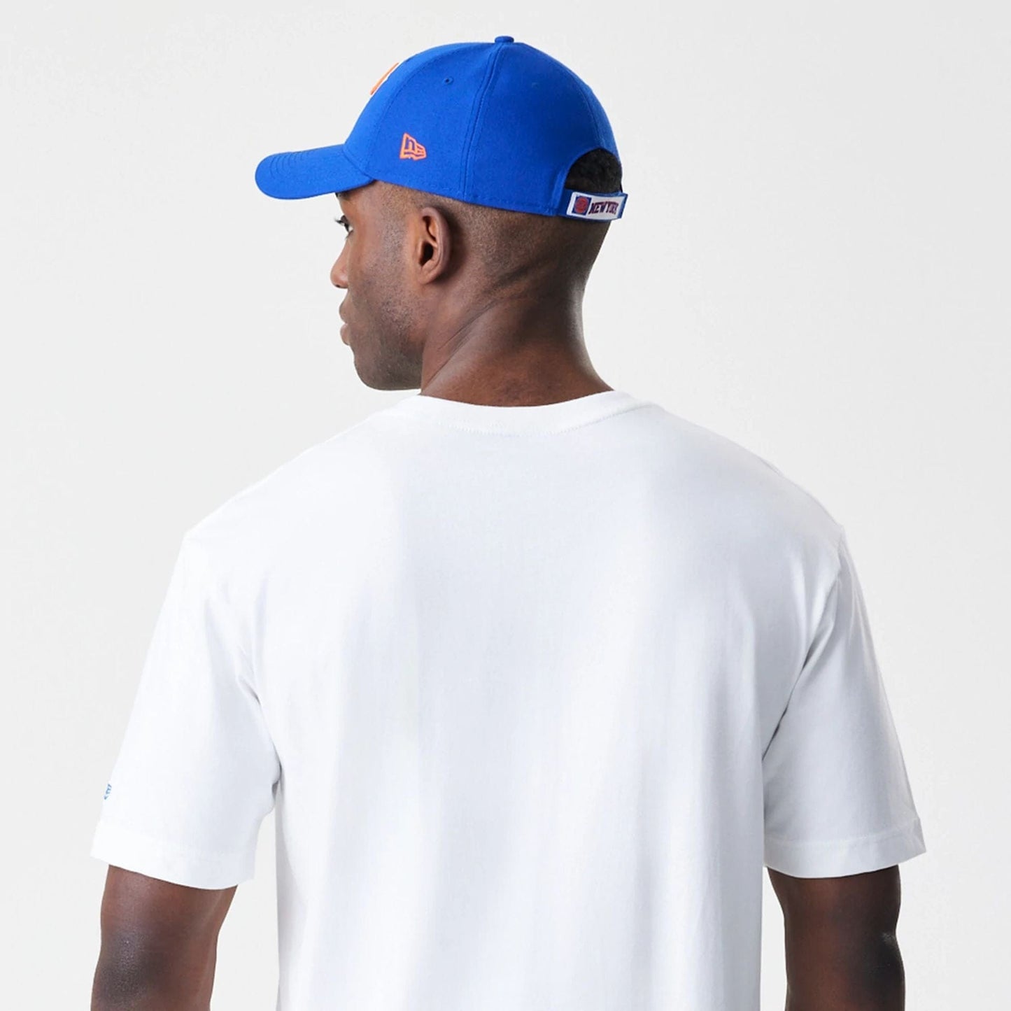 The Male model is wearing New York Knicks Throwback Prep White T-Shirt 5