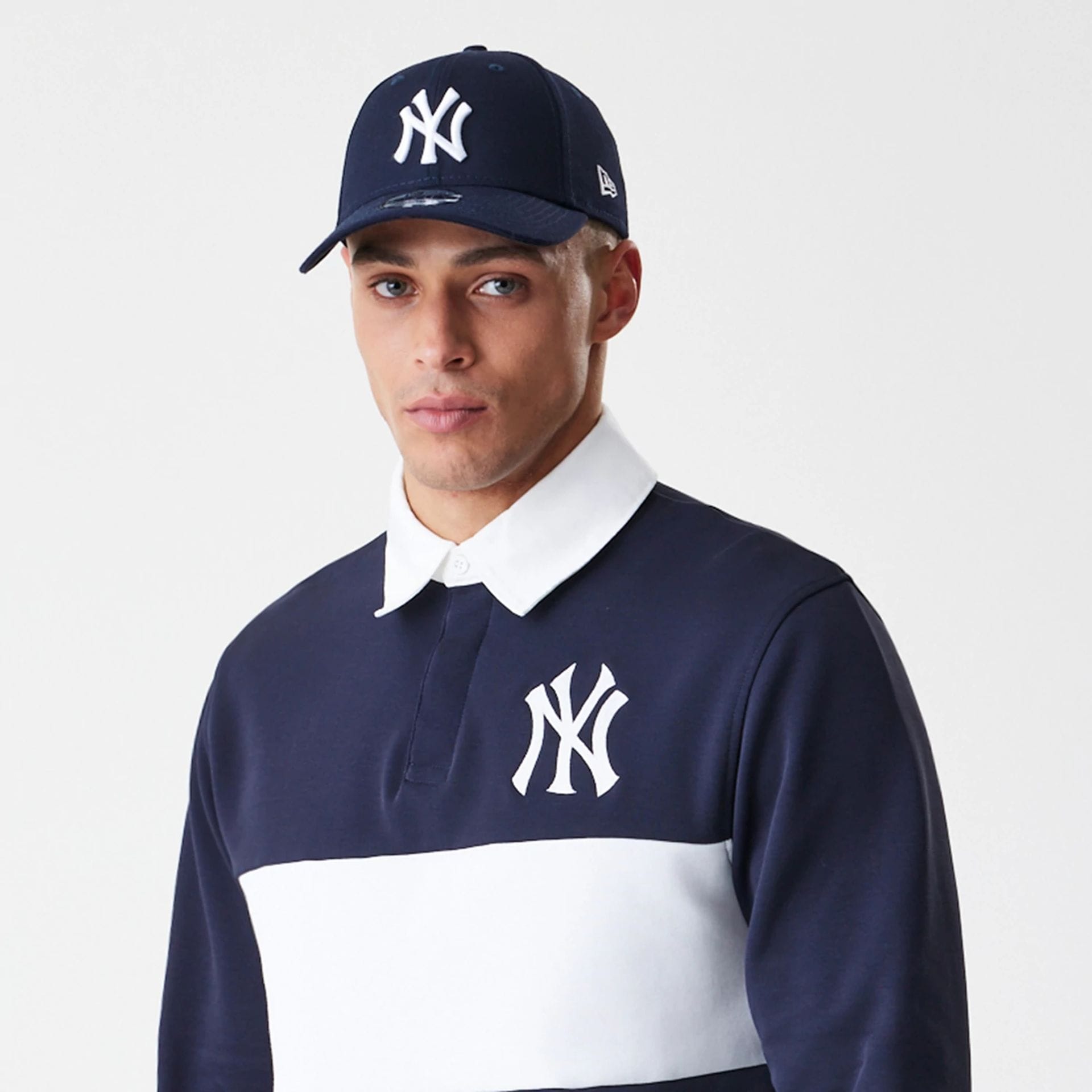 The Male model is wearing New York Yankees Throwback Prep Navy Long Sleeve Rugby Shirt 3