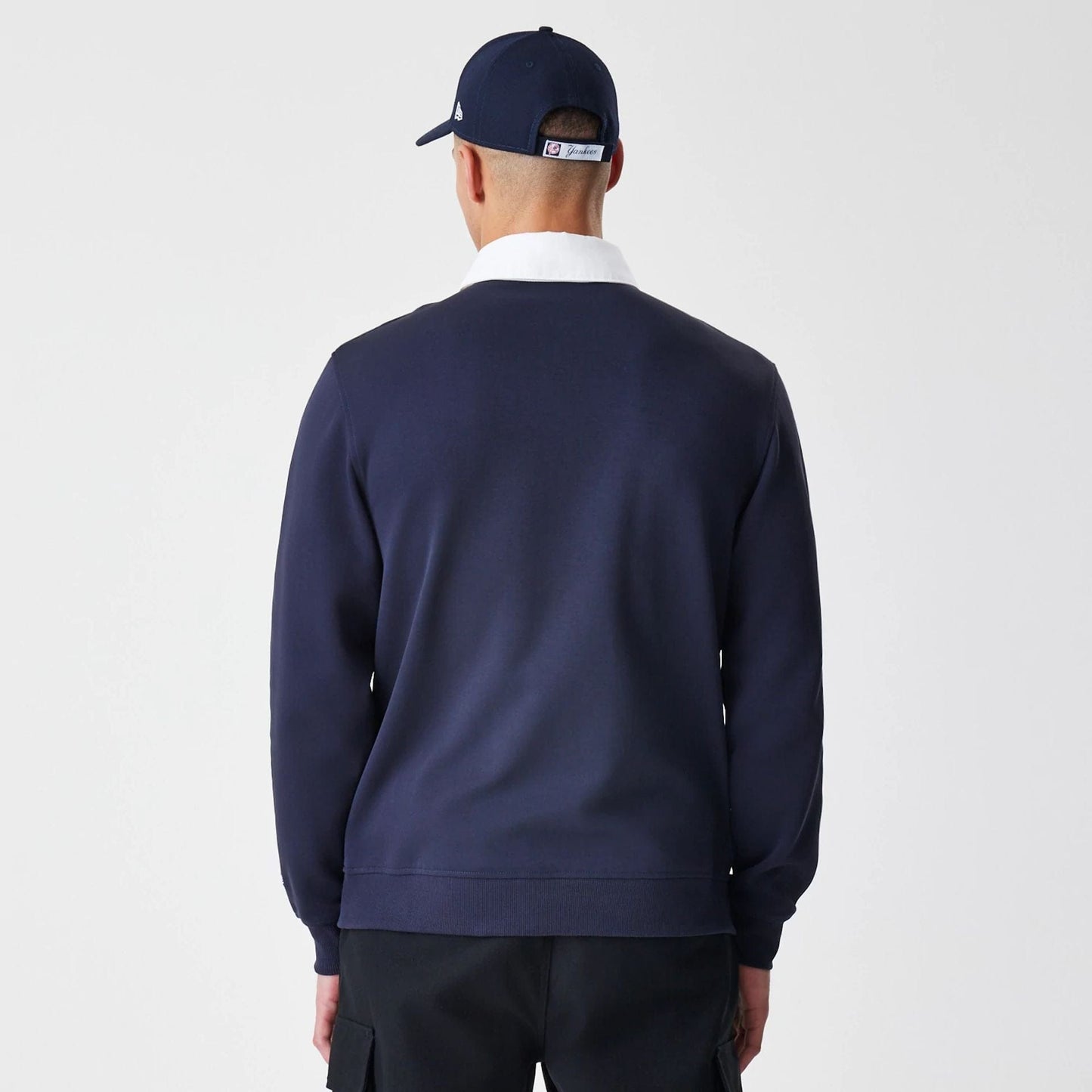 The Male model is wearing New York Yankees Throwback Prep Navy Long Sleeve Rugby Shirt 2