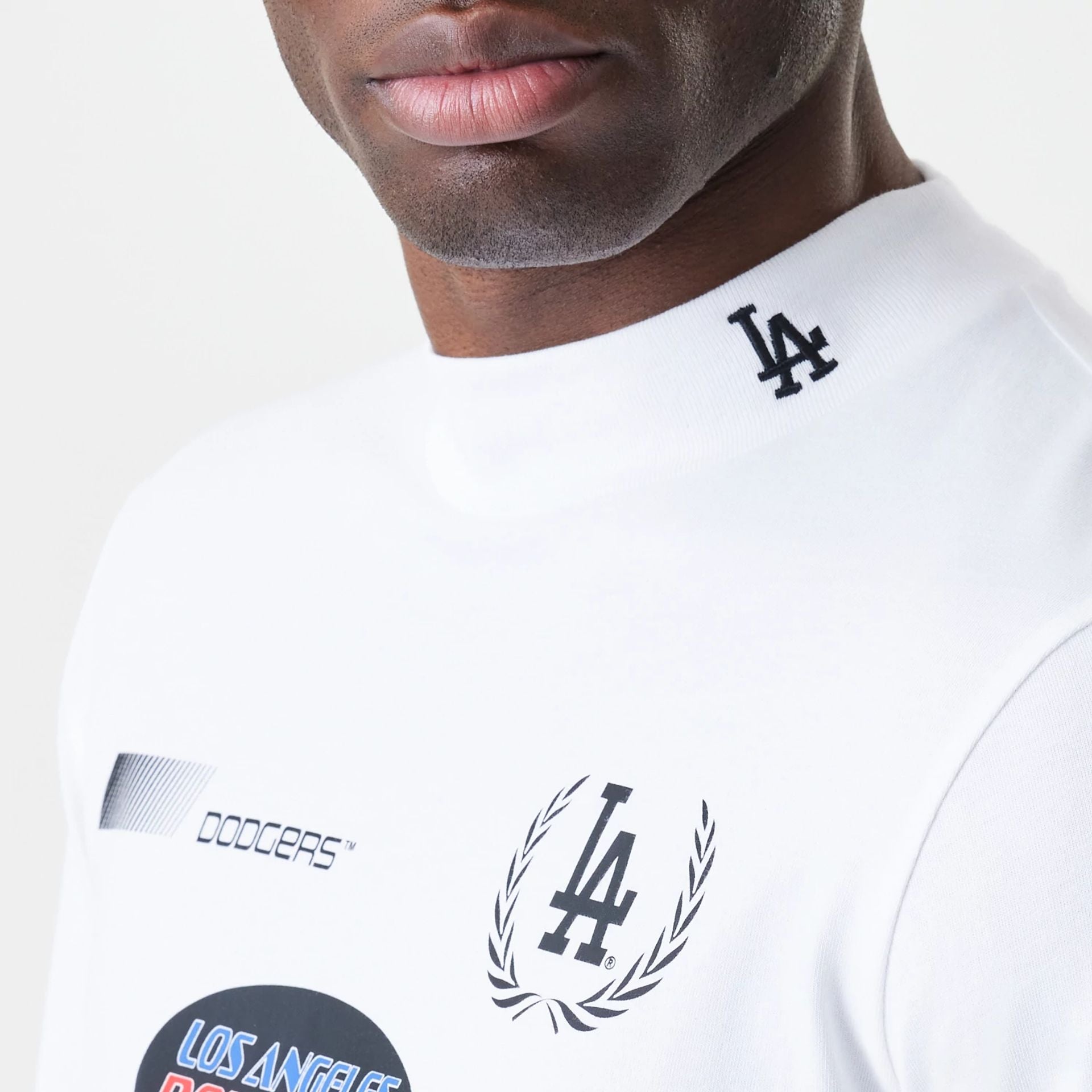 The Male model is wearing LA Dodgers Modern Driver White Long Sleeve T-Shirt 2