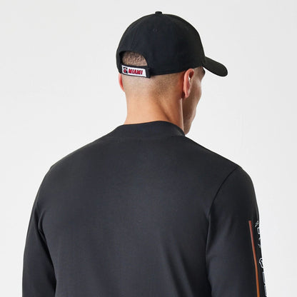 The Male model is wearing Miami Heat Modern Driver Black Long Sleeve T-Shirt 5
