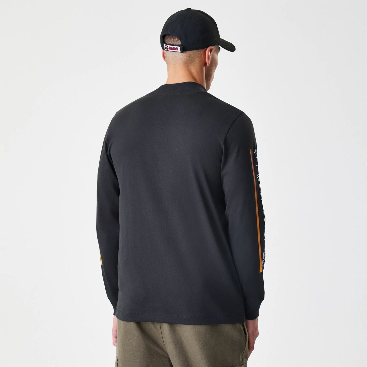 The Male model is wearing Miami Heat Modern Driver Black Long Sleeve T-Shirt 3