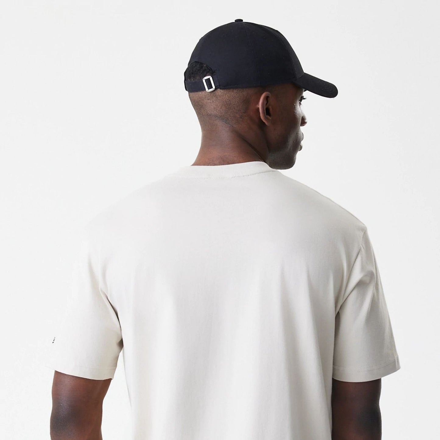 The Male model is wearing Nascar Generic Logo Modern Driver Light Beige T-Shirt 5