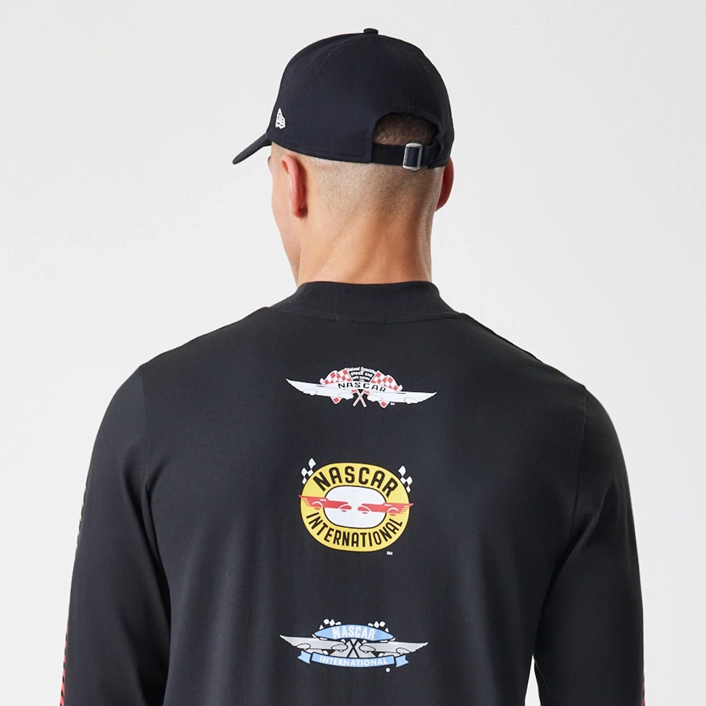 The Male model is wearing Nascar Generic Logo Modern Driver Black Long Sleeve T-Shirt 5