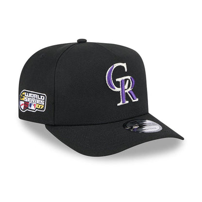 Colorado Rockies MLB Evergreen Black New Era 9FIFTY A-Frame Snapback Adjustable Cap, three-quarter view showing raised white and purple CR logo on the front panel, with a World Series 07 patch on the side and a 9FIFTY size sticker on the black visor.