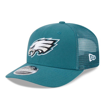 Philadelphia Eagles NFL Evergreen Dark Green New Era 9SEVENTY Stretch Snap Cap, three-quarter view showing the raised embroidered Eagles logo on the front panel, with a mesh back and a 9SEVENTY size sticker on the dark green visor.